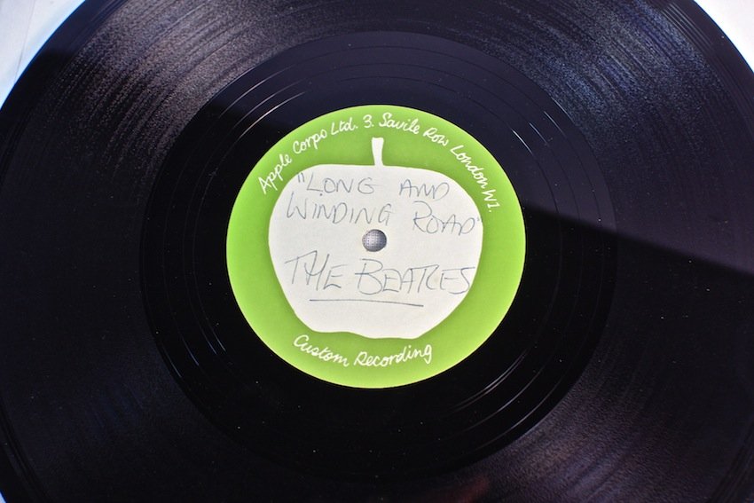 The Beatles Long And Winding Road Apple Corps Acetate: The Beatles Long And Winding Road Apple Corps Acetate. A single sided 10" 45rpm acetate recording with an Apple Corps Ltd custom recording label. Titled in blue ballpoint pen, "Long And Winding Road, 