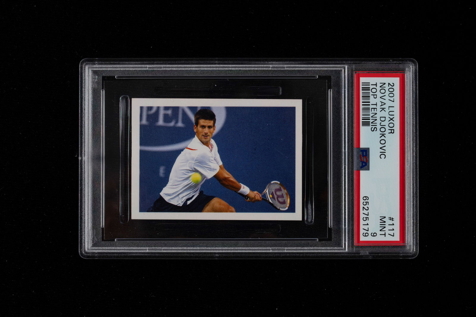 Novak Djokovic - Graded card - Luxor Top Tennis - 2007 - PSA 9: Novak Djokovic's 2007 Luxor Top Tennis set, graded with PSA 9. This piece is considered a "Rookie Card" (or more accurately, a rookie sticker) for Djokovic. The Luxor Top Tennis set was produced in Be