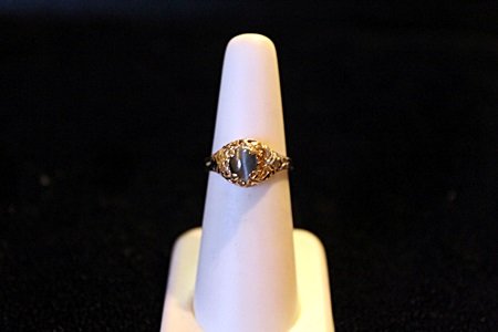 Lady's Cat's Eye Alexandrite 14kt Solid Gold Ring: Lady's Solitaire Natural Alexandrite 1.39ct Cats Eye Oval Cabochon Cut, Color Change Green to Purple, 14kt solid yellow gold wieght 3.2 grams and a ring size approx 5, Also included in the sale GIA Es