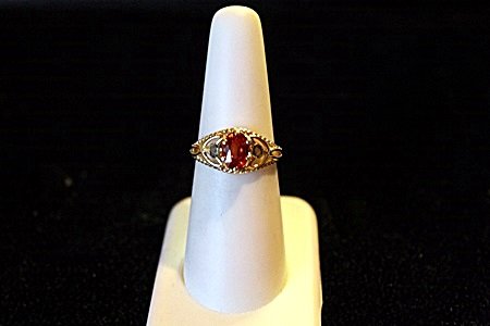 Antique Style 14K Yellow Gold Ruby/Alexandrite Ring: Antique Style 14K Yellow Gold Ruby/Alexandrite Ring. This ring is compromised of 6 prongs set oval cut ruby surrounded by 2 bezel set round cut alexandrites. Ruby Approx 1.64cts, Alexandrites approx .