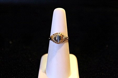 Lady's Cat's Eye Alexandrite 14kt Solid Gold Ring: Lady's Solitaire Natural Alexandrite 1.39ct Cats Eye Oval Cabochon Cut, Color Change Green to Purple, 14kt solid yellow gold wieght 3.2 grams and a ring size approx 5, Also included in the sale GIA Es