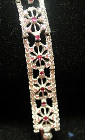 Beautiful Sterling Silver Ruby & White Sapphire: Beautiful Sterling Silver Ruby & White Sapphire Bracelet. Rubies approx .63 ct, Sapphires approx 3.52 cts. Hidden clasp with locks. Approx length 7 in. Total weight approx 17.6 grams.
