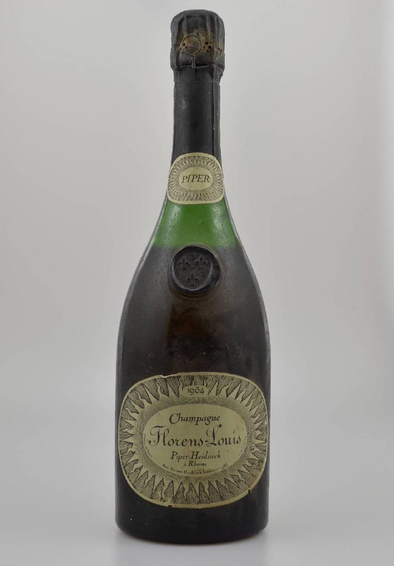 1 bottle 1964 Florens-Luis Champagne: 1 bottle 1964 Piper-Heidsieck Florens-Luis Champagne, Reims, distance between bottle bottom and champagne: approx 3 cm, not tasted, label tanned and soiled, rarely on offer, hardly available on the ma