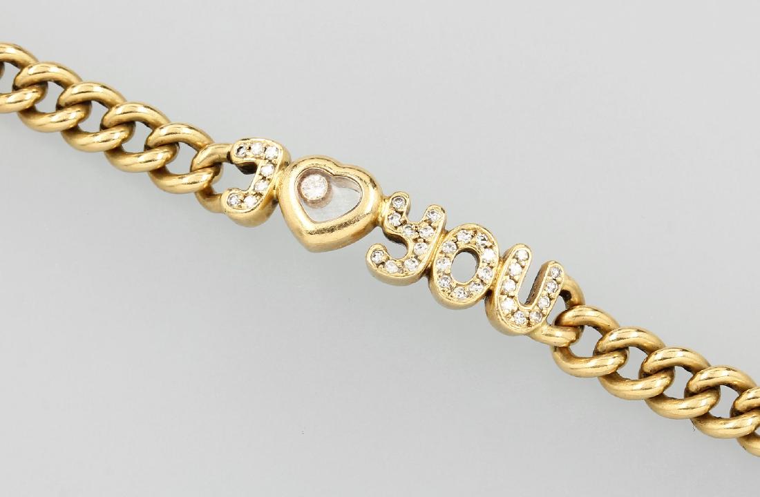 18 kt gold CHOPARD bracelet Happy Diamonds: 18 kt gold CHOPARD bracelet Happy Diamonds ,lettering I love you, heart with movable diamond under glass, 33 8/8-diamonds total approx. 0.22 ct Wesselton/si, approx. 31.1 g, l. approx. 20 cm, case loc