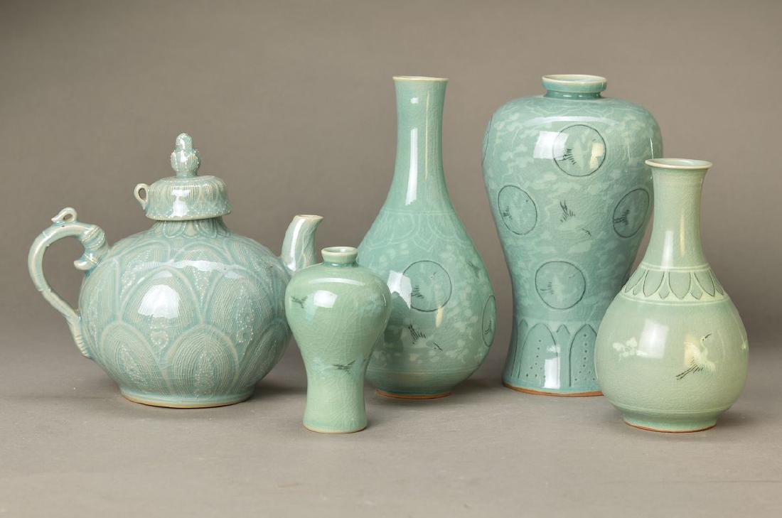 5 parts of ceramic, Korea, 20th c., with seladon: 5 parts of ceramic, Korea, 20th c., with seladon green glaze, decor of cranes and clouds, tea pot H. approx. 17cm, 4 vases H. approx. 21/21.5/16.5/11cm