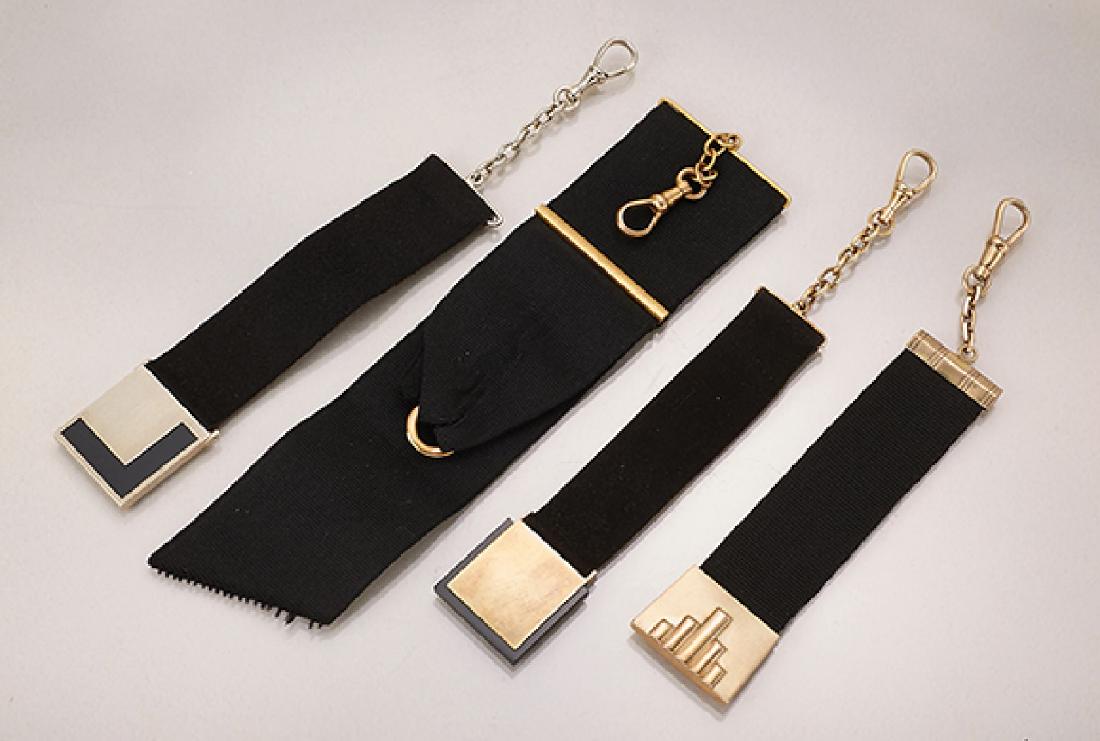 Lot 4 watch chatelaines, german approx. 1930s: Lot 4 watch chatelaines, german approx. 1930s, black corded ribbons with YG 333/000 appliques, each with lobster clasp, w. approx. 1.5 - 3 cm, l. approx. 12 - 17 cm