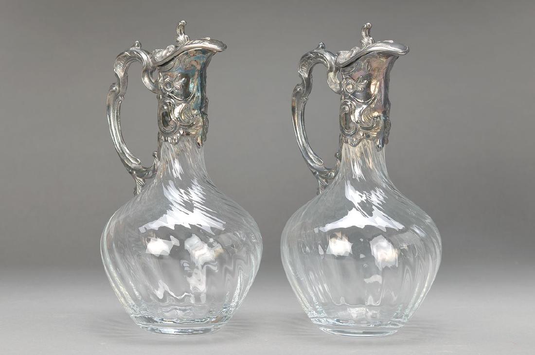 couple of carafes, France, around 1900, silverplated: couple of carafes, France, around 1900, silverplated metal, optical blown glass corpus, H. 28 cm, rococo decoration and floral decor