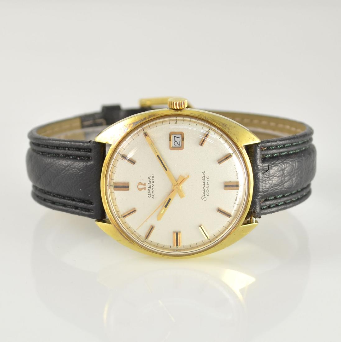 OMEGA Seamaster Cosmic gents wristwatch: OMEGA Seamaster Cosmic gents wristwatch, Switzerland around 1969, self winding, gold plated monocoque-case reference 166.026 abraded, silvered dial with raised gilded indexes dent, date at 3, original