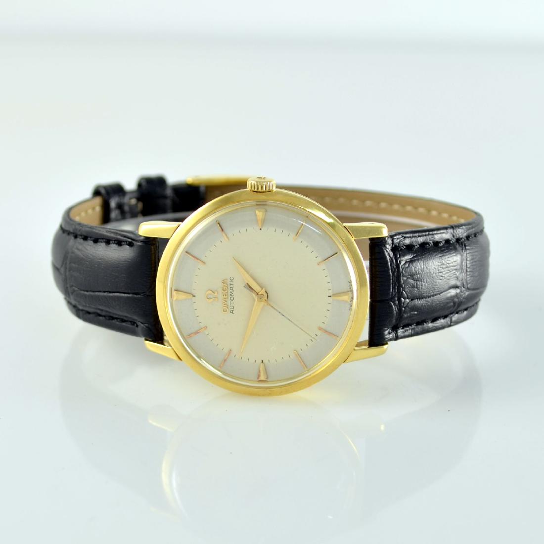 OMEGA 18k yellow gold gents wristwatch: OMEGA 18k yellow gold gents wristwatch, Switzerland around 1957, self winding, 3-piececonstruction case, snap on case back & bezel, silvered duotone-dial with raised gilded indexes restored, gilded Da