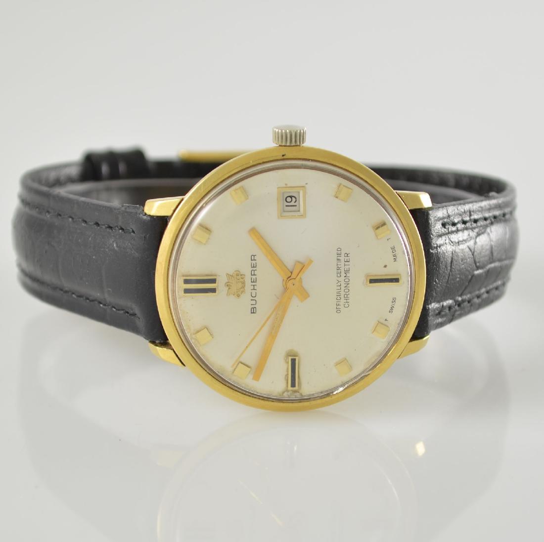 BUCHERER 18k yellow gold chronometer wristwatch: BUCHERER 18k yellow gold chronometer wristwatch, Switzerland around 1965, self winding, monocoque-case, silvered dial with raised gilded indexes, date at 3, gilded hands, rhodium plated movement calib