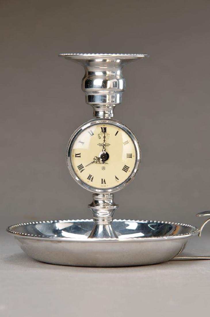 Jaeger LeCoultre alarm clock 'candle holders', around: Jaeger LeCoultre alarm clock 'candle holders', around 1960, metal chromed, encircling pearl rim decor, Reference 130, caliber 245, running period. approx. 8 days, alarm regulation under number 12, wit