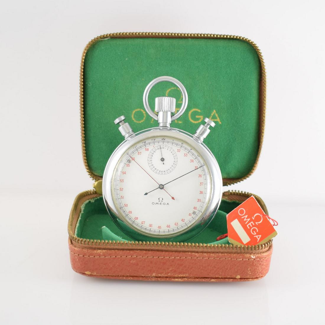 OMEGA oversized chronograph rattrapante with original: OMEGA oversized chronograph rattrapante with original box & Hangtag, Switzerland around 1960, reference MG 1135, enamel colored dial with black & red scaling, 60-seconds & 30- minutes register, gold-p