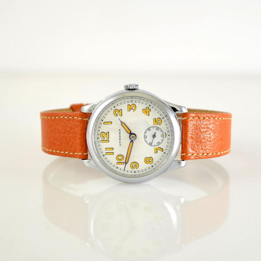 ETERNA the first real wristwatch from Eterna: ETERNA the first real wristwatch from Eterna, Switzerland around 1920, manual winding, chromed hinge-case, enamel dial hairlines/ repaired, Arabic luminous numerals, luminous material such as luminous