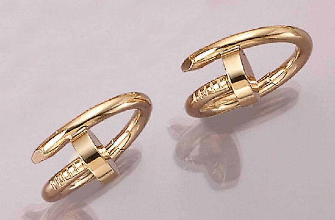 Pair of 18 kt gold CARTIER cufflinks: Pair of 18 kt gold CARTIER cufflinks , YG 750/000, 'JUSTE UN CLOU', signed