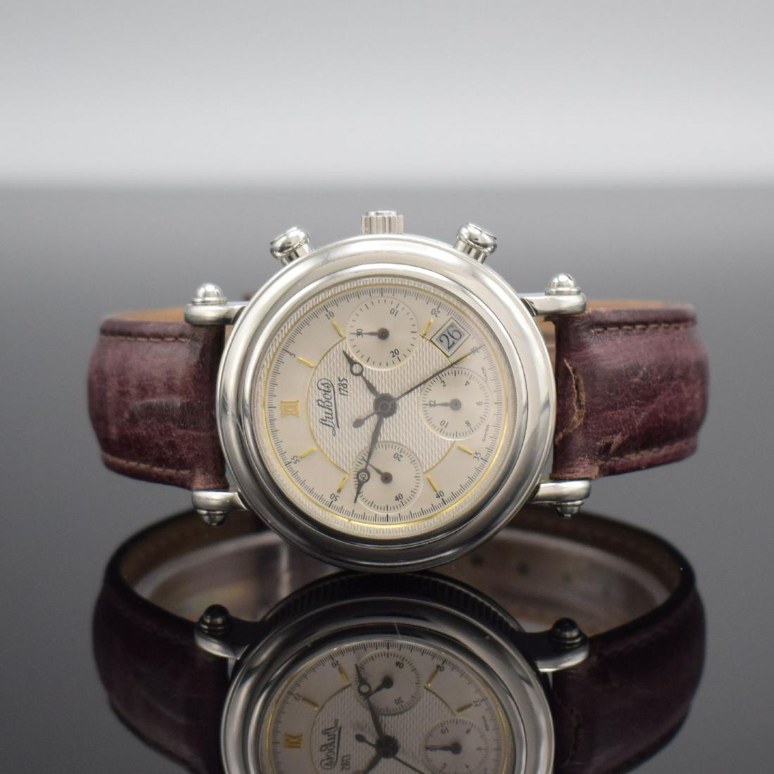 DuBOIS Montre Monnaie gents chronograph: DuBOIS Montre Monnaie gents chronograph in steel/leather strap, Switzerland around 2000, self winding, on both sides glazed case with coin-edge band, snap on case back, silvered dial partial engine-tu
