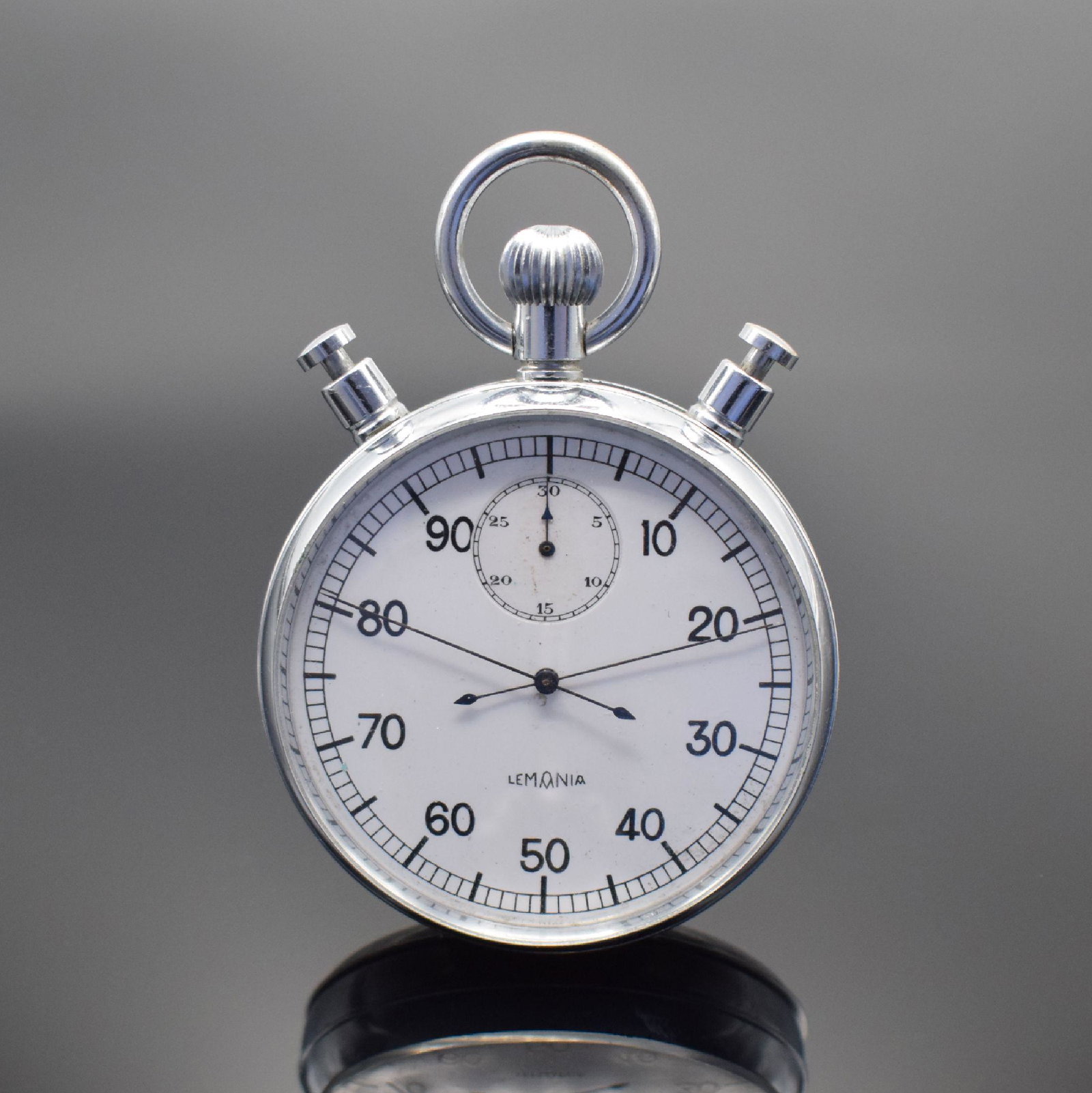 LEMANIA big stop watch with Rattrapante: LEMANIA big stop watch with Rattrapante, Switzerland around 1940, manual winding, chrome-plated case, enamel dial, blued steel hands, 5-minutes-counter, dezimale second- counter, gold-plated movement 