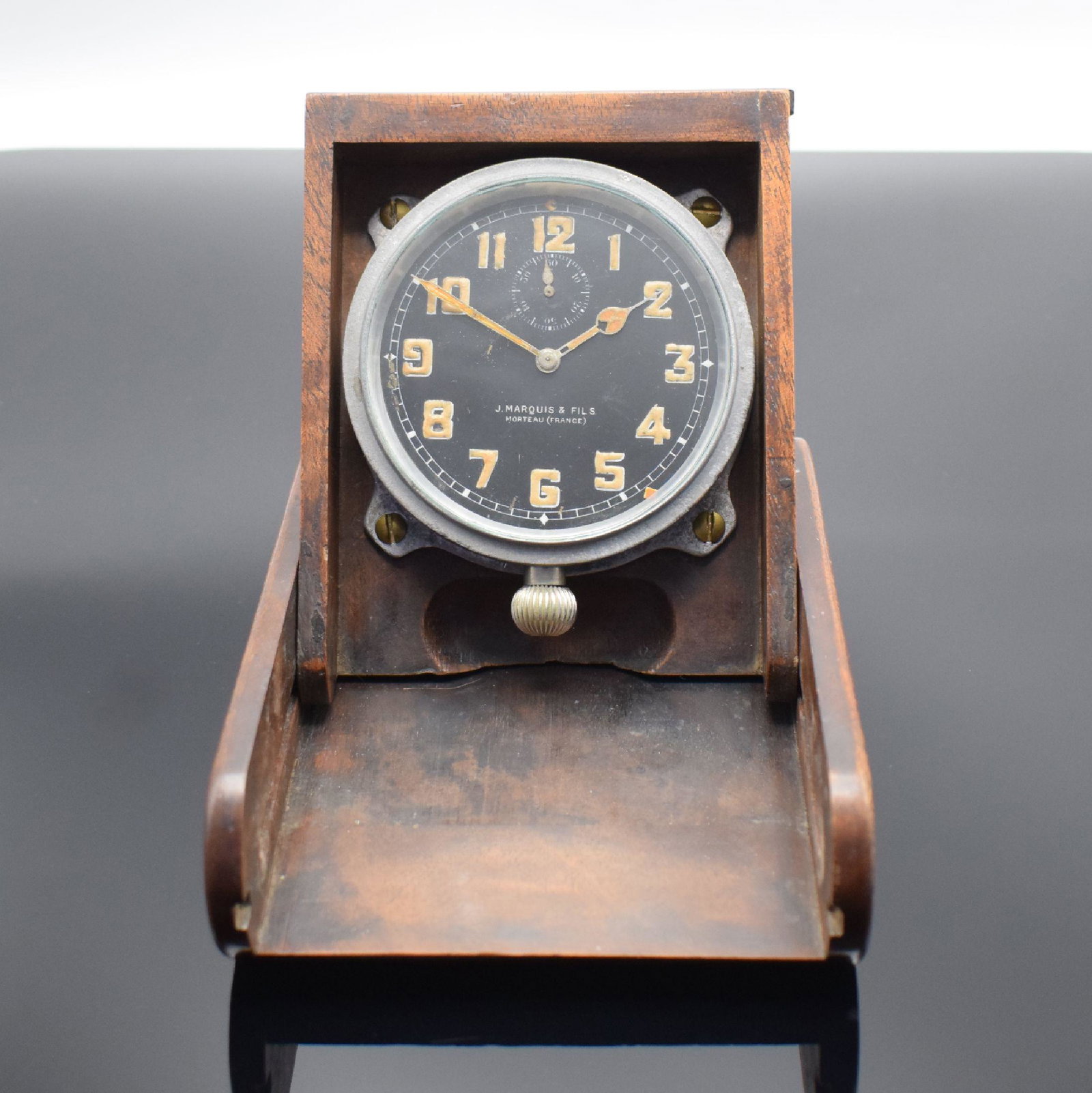J. MARQUIS & Fils Morteau Aircraft Clock: J. MARQUIS & Fils Morteau Aircraft Clock, France around 1930, folding wooden box later, black dial with Arabic luminous numerals, luminous hands, setting at 6, measures closed approx. 14,7 x 11,1 x 4 