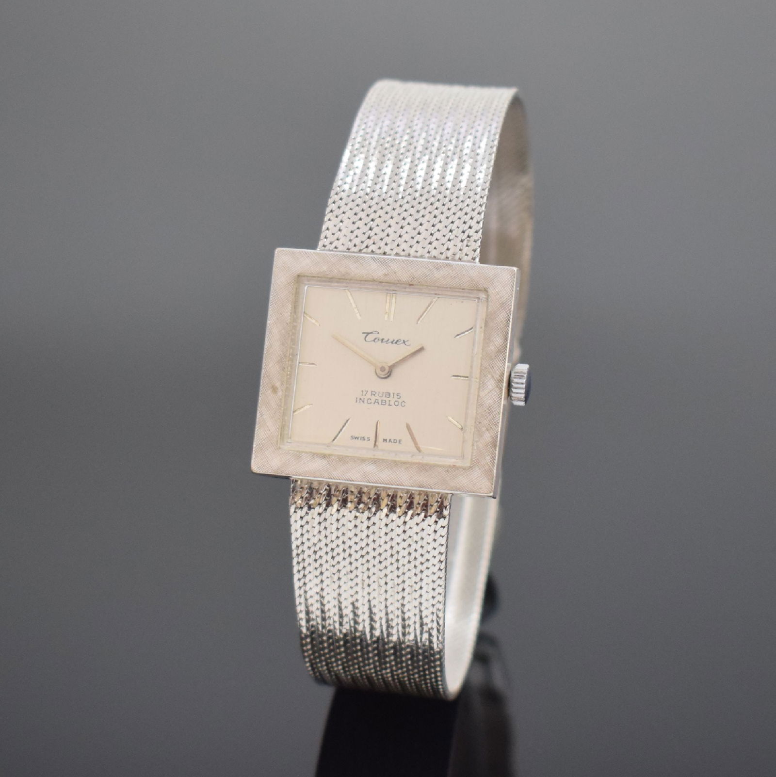 COMEX 14k white gold wristwatch: COMEX 14k white gold wristwatch, Switzerland around 1960, manual winding, two-piece construction case, snap on case back, milanese-bracelet in white gold 14k, silvered dial with applied hour-indices,