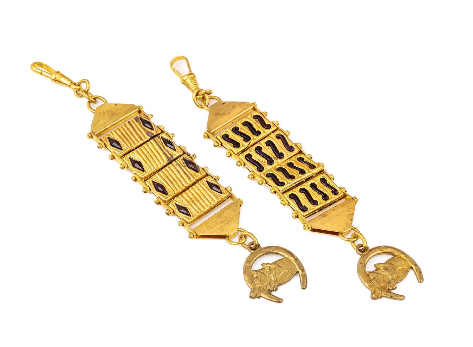 Set 2 chatelaines: Set 2 chatelaines , metal gilt, probably Jakob Bengel, 1920s-30s, with amethyst coloured plastic inlays, movable suspensions with horseshoe and horse heads, l. approx. 16 cm, signs of usage