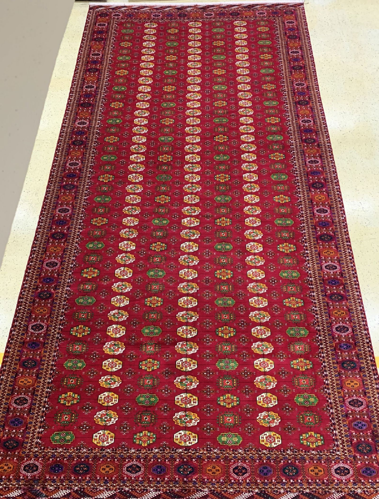 Bukhara#'Palace Carpet#', Turkmenistan, commissioned: Bukhara#'Palace Carpet#', Turkmenistan, commissioned work, approx. 10 years, wool on wool, approx. 720 x 364 cm, lower border discolored & moth-eaten with 10 cm crack). Rugs, Carpets & Flatweaves