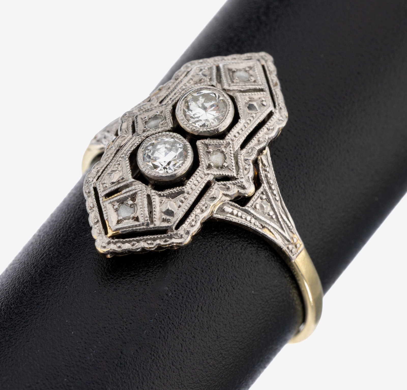 14 kt gold Art Deco diamond-ring: 14 kt gold Art Deco diamond-ring , YG/WG 585/000, geometric, ring head WG, fret work, 2 brilliants total approx. 0.20 ct Wesselton/si-p, small diamond roses, ringsize 58, approx. 2.7 g