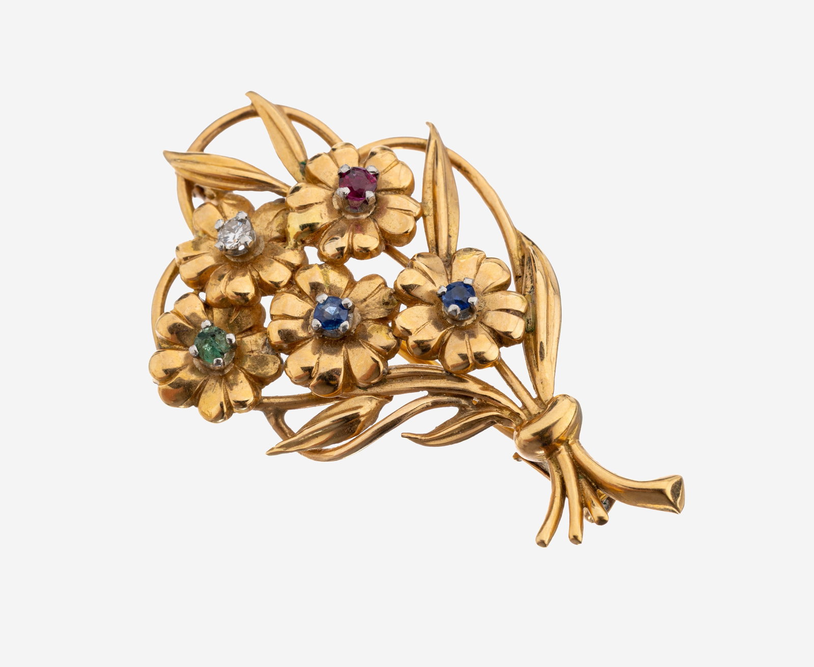 18 kt gold coloured stone-brilliant-brooch: 18 kt gold coloured stone-brilliant-brooch ,1960s, YG 750/000, floral design, 2 round bevelled sapphires, 1 round bevelled ruby and 1 round bevelled emerald total approx. 0.18 ct, 1 brilliant approx. 