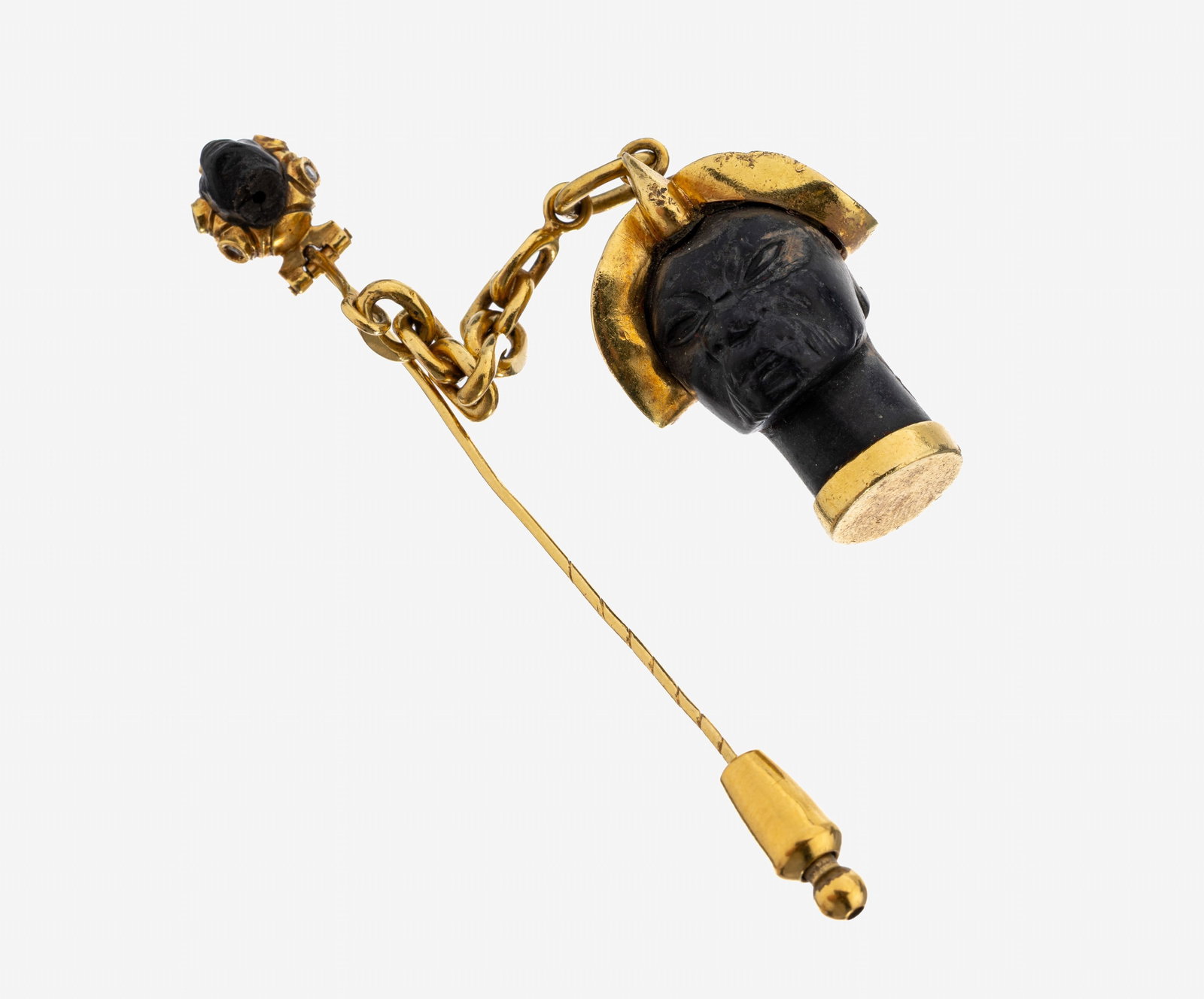 18 kt gold diamond-pin: 18 kt gold diamond-pin , YG 750/000, movablesuspension with man's head made of ebonized wood, with helmet, oberhalb small man's head, turban with 5 small 8/8-diamonds, l. approx. 8.5 cm, approx. 23.0 