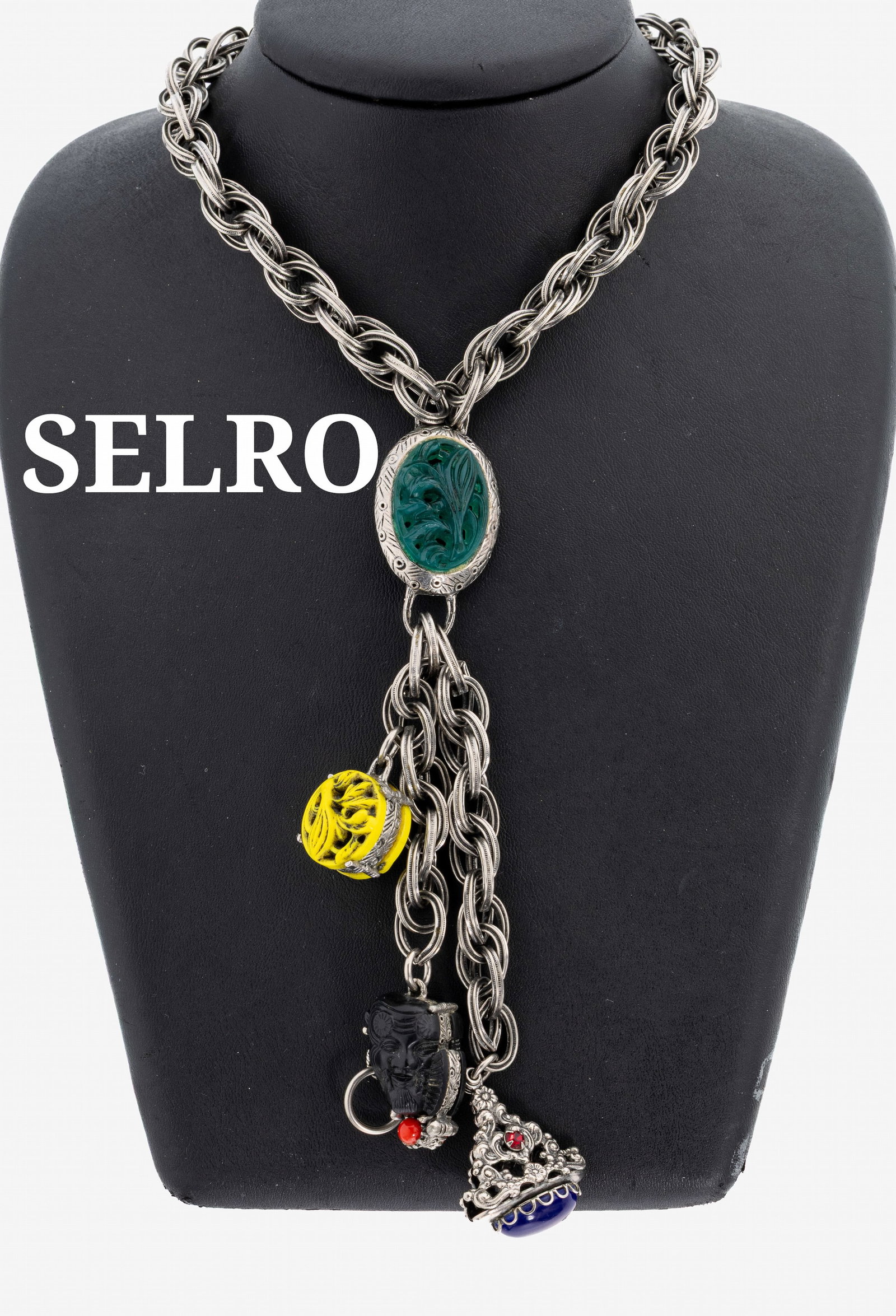 SELRO costume jewellery Y-necklace, USA 1950/60s: SELRO costume jewellery Y-necklace, USA 1950/60s , different Asian elements as charm suspensions, synthetical in different colours, chain part silver coloured metal, l. approx. 37- 44 cm, total l.