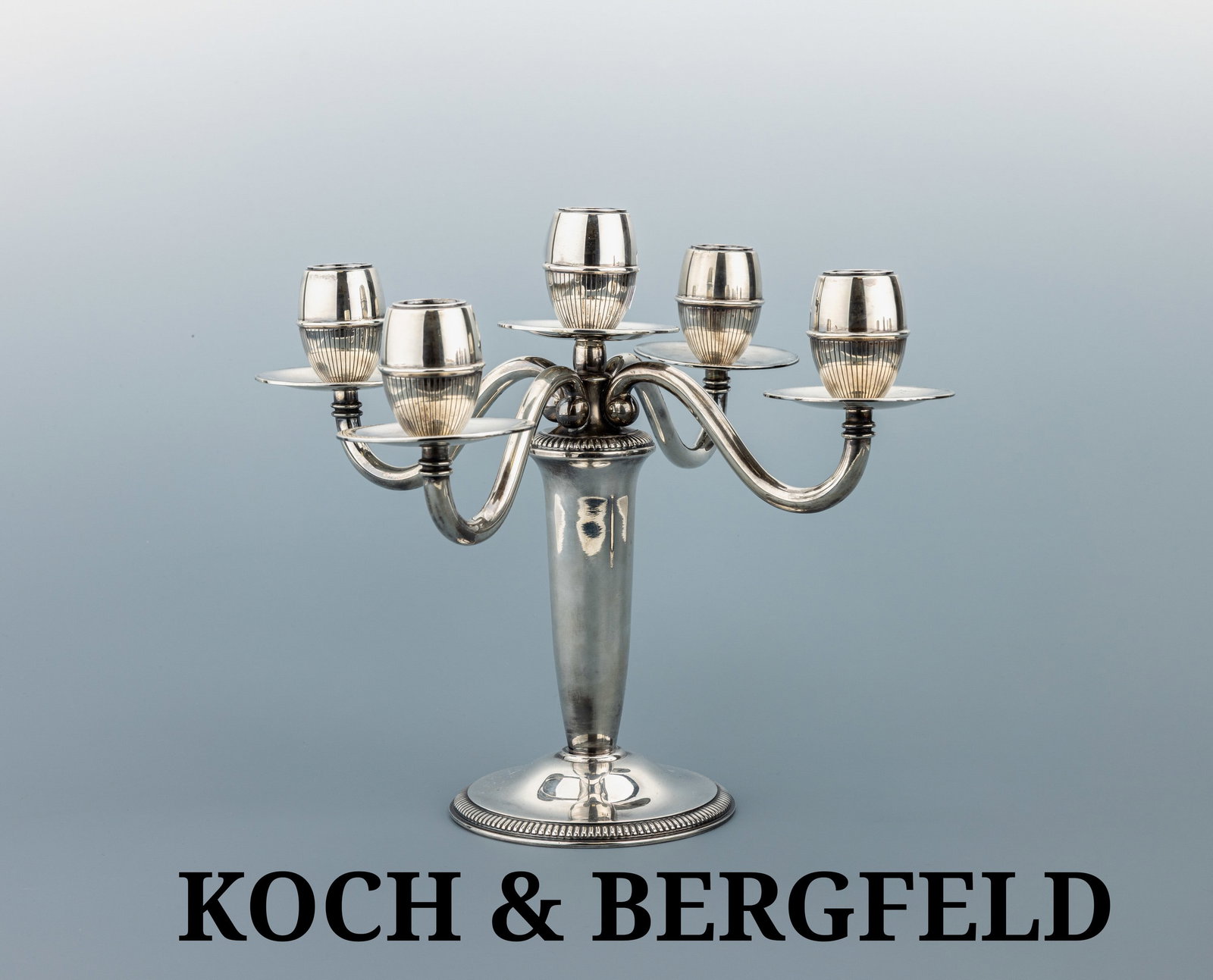 KOCH & BERGFELD 5-light candelabrum, 1950s: KOCH & BERGFELD 5-light candelabrum, 1950s , Sterling silver 925, finely crafted five- light candelabrum with circular base decorated with a beaded border, scrolling armswith fluted acorn-shaped
