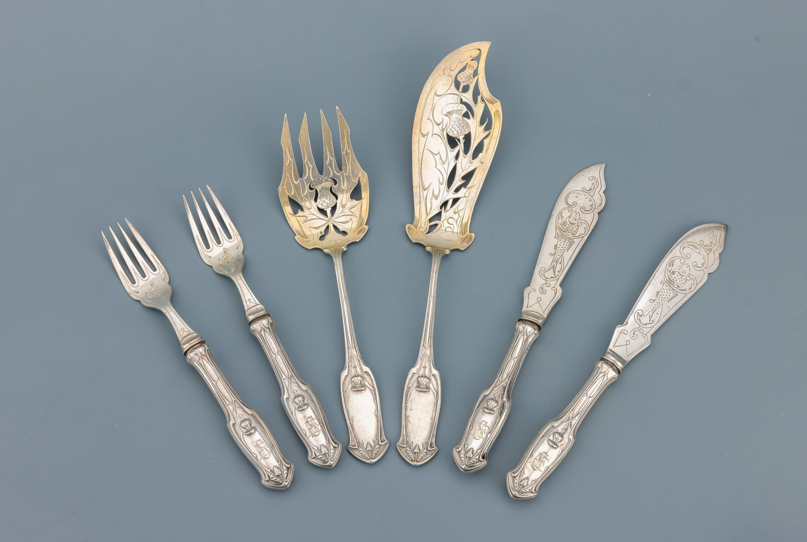 Art Nouveau-fish table service for 6 persons, german approx. 1900: Art Nouveau-fish table service for 6 persons, german approx. 1900 , 800 silver, partly gilt, floral decor with thistles, symmetric design, owner's monogram, comprised of: 6 knives and 6 forks (handles