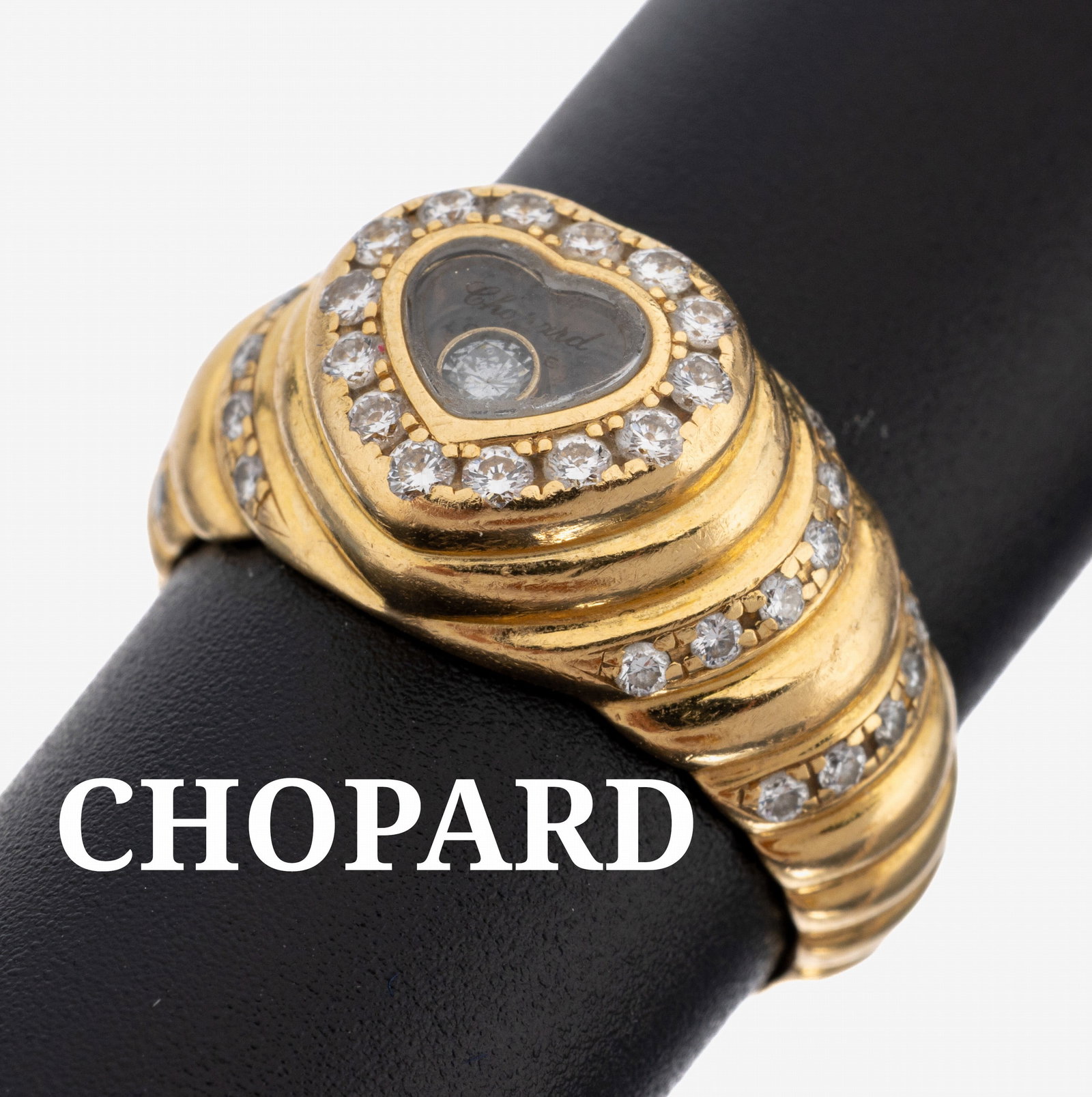 18 kt gold CHOPARD brilliant-ring: 18 kt gold CHOPARD brilliant-ring , YG 750/000, heart shaped ring head, 1 brilliant movable behind glass approx. 0.05 ct and 36 brilliants total approx. 0.46 ct ct Wesselton/vsi, ringsize 53, approx. 