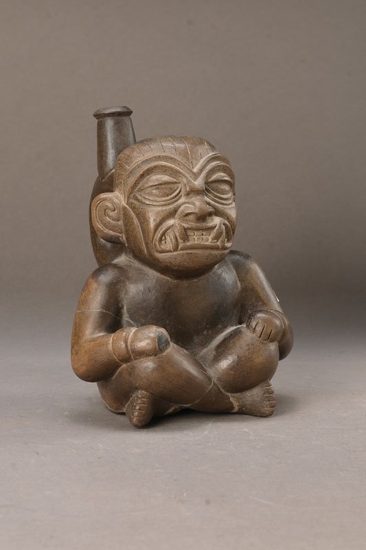 Stirrup vessel, Moche I: Stirrup vessel, Moche I, approx. 2100 years old, in shape of a seated Katzike with Mask ofFelidae, very expressive, ideal.- realistic reproduction, fine work of facial expression, nose and eye rims do