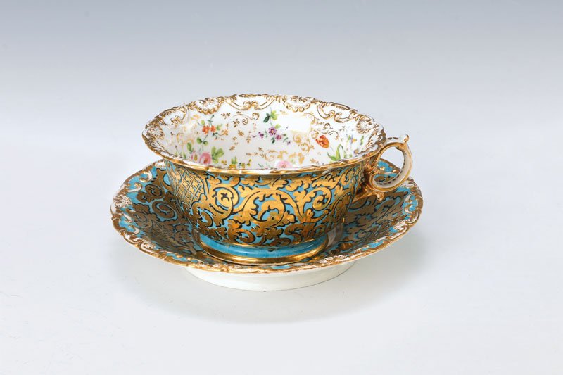 Large cup with saucer, Jacob Petit: Large cup with saucer, Jacob Petit, around 1870, outside blue ground with golden rococo decor, black heightened, interior with rich floral decoration, gold decoration, seashell edge, Age Related abrad