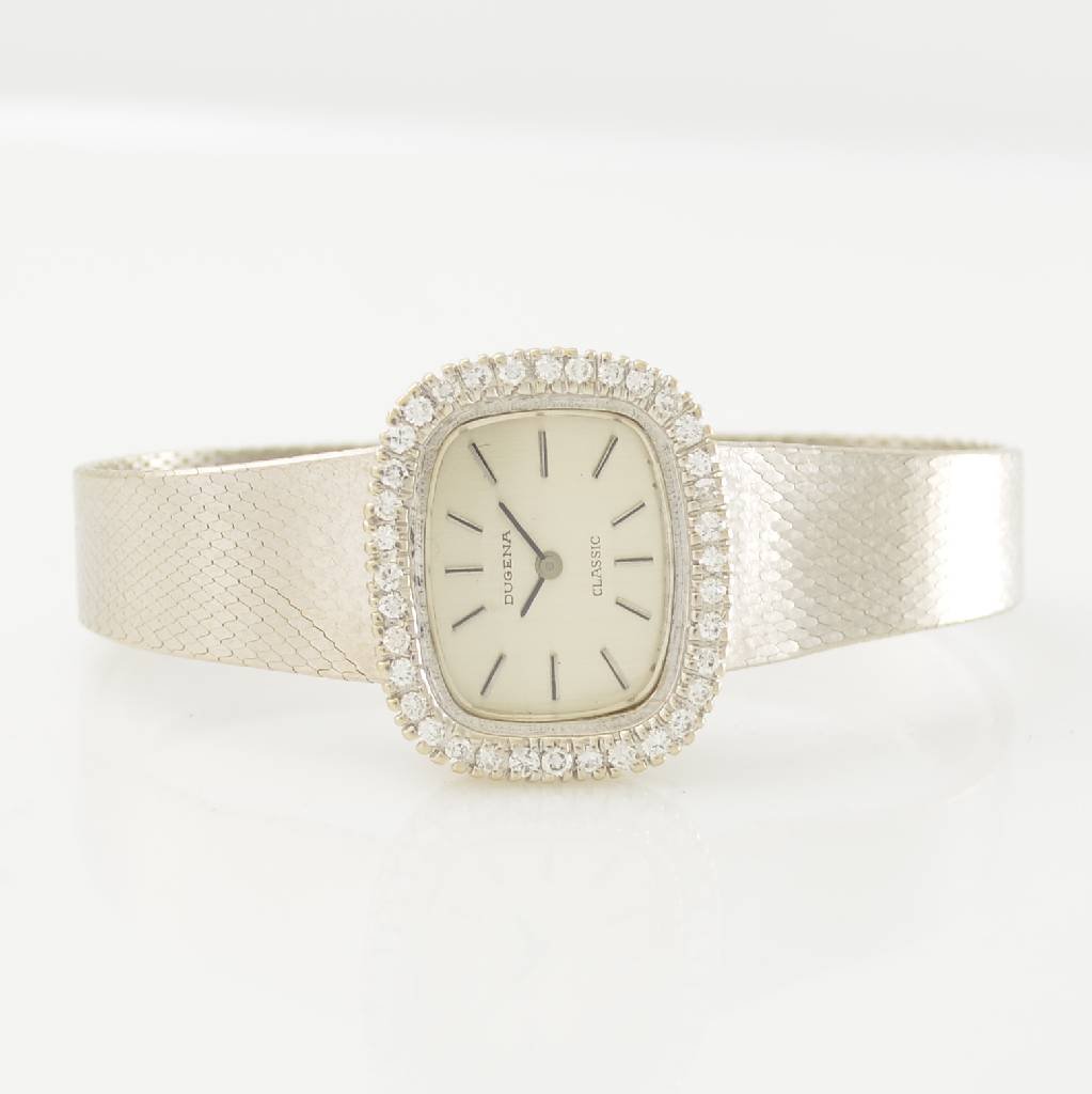 DUGENA 14k white gold ladies wristwatch: DUGENA 14k white gold ladies wristwatch, 1970´s, manual winding, silvered dial, bezel lavish set with diamonds additional approx. 0,75 ct, display of hours & minutes, snap on case back, calibre AS 19