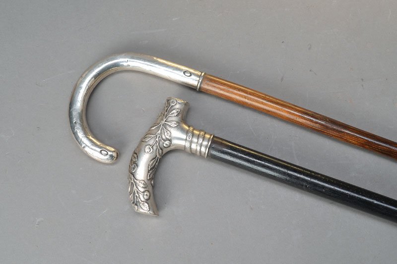 two canes with silver handles