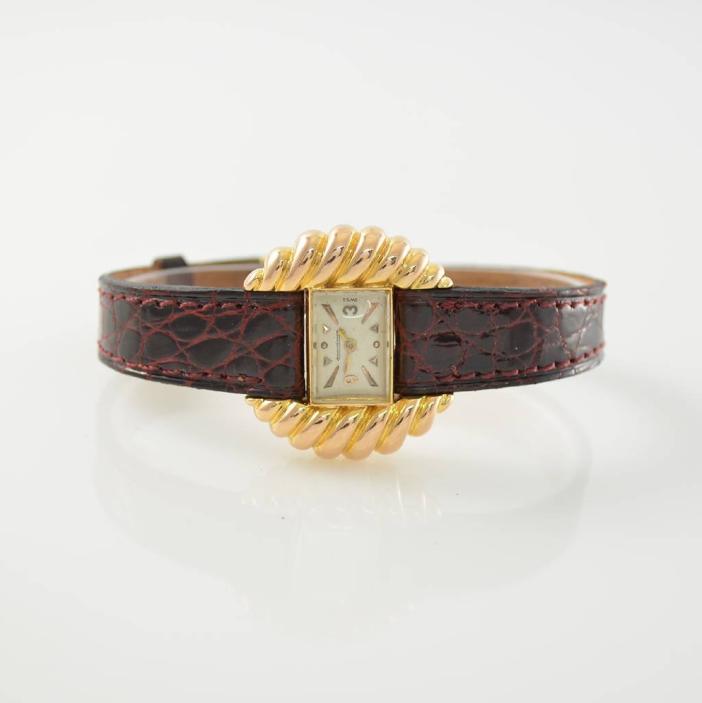 Jaeger-LeCoultre early unusual 18k pink gold wristwatch: Jaeger-LeCoultre early unusual 18k pink gold ladies wristwatch, Switzerland 1940`s, silvered dial with raised hour-indexes, screwed down case back, gold-plated movement, screw balance, blued spring, h