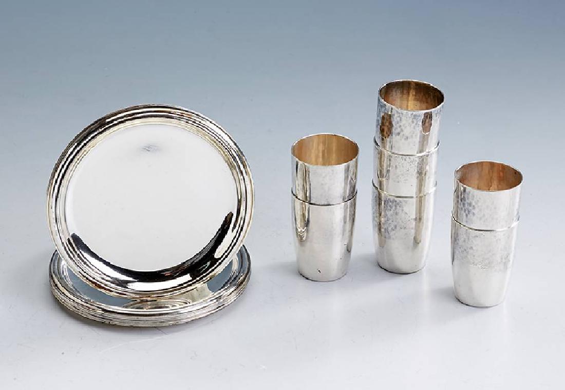 Lot in silver 835, german approx. 1900: Lot in silver 835, german approx. 1900, comprised of: 11 trivets, W. Binder Schwaebisch Gmuend, diam. approx. 10 cm and 7 schnapps beaker, hammer finished, h. approx. 4,5 cm