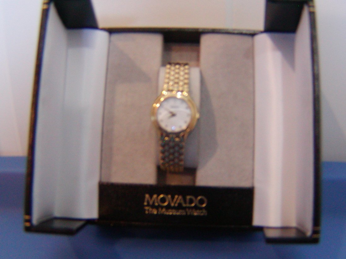 Ladies Movado Watch: Gold Tone ladies watch serial 33061373 In original box