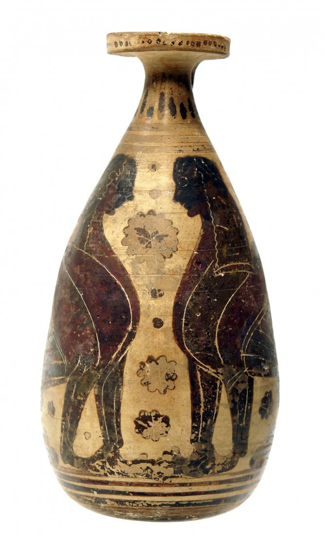Ancient Corinthian Pottery Painted Alabastron: Ca. 6th Century BC. A lovely vase with tear shaped body and fabulous decoration consisting of twin sirens symmetrically facing each other on either side; rosettes and dots in field; zigzag on the neck