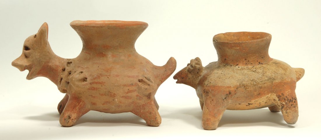 Pre-Columbian Pair Nayarit Animal Vessels (2): Mexico, circa 100 BC - 250 AD. A pair of cute molded red-ware pups with triangular faces and incised facial features. Open atop with vessel rims. Painted with bi-chrome pigment. Lengths: 5 - 6.5 inche