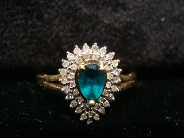 Pear shape Emerald surround by diamonds: Pear shape Emerald surround by diamonds