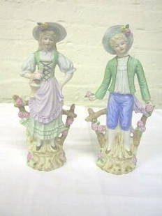 Pr. Andrea Occupied Japan Figurines.: These figurines are hand painted and stamped on the bottom Andrea Made in Occupied Japan. The boy is 9-1/2" tall and the girl is 9-1/4" tall. They are dressed in country clothes and are standing by