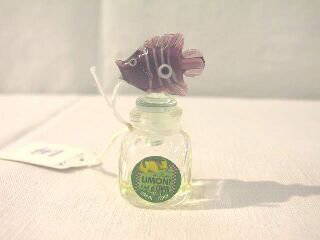 Miniature Italy Limoni Perfume Bottle w. Fish.: This would make a nice addition to any collection. It is a 5ml bottle of Limoni di Capri and is 2-1/8" tall. The paper label is attached to the front and has the name of the perfume and also says