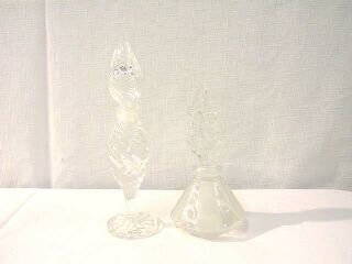 2 Clear Perfume Bottles: This perfume bottle is 7-3/4" tall. The base and the stopper are swirled glass. It is in very good condition, however the dauber is not intact. The second bottle is clear and frosted. The stopper