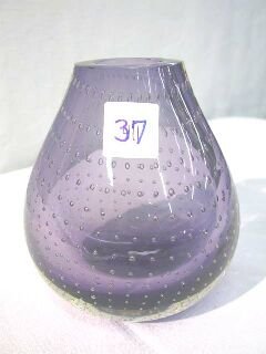 Amethyst Controlled Bubble Pairpoint? Vase: This is a heavy vase, amethyst in color that has been hand blown with a controlled bubble. There are rows of bubbles from the bottom to the top of the vase that are almost uniform in appearance. This