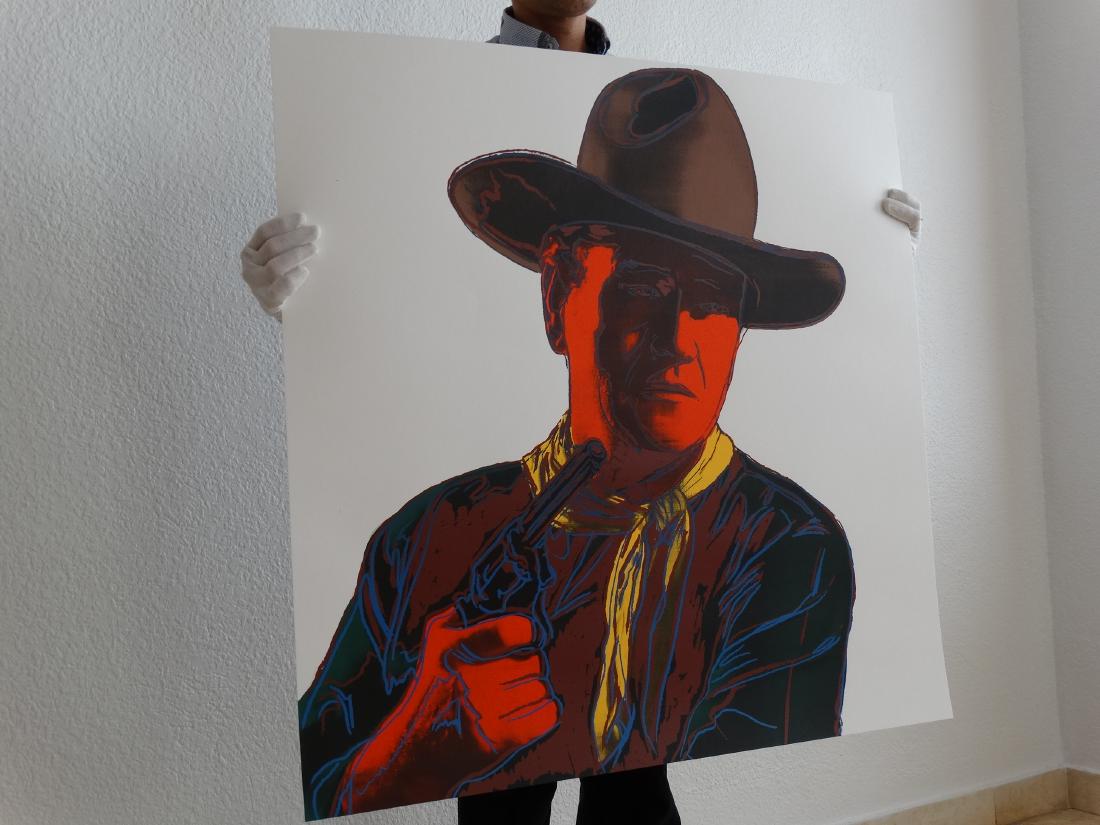 Andy Warhol: John Wayne: 1986: John Wayne (F./S. II. 377), 1986, screenprint in colors on Lenox Museum Board, ', with the inkstamp of the publisher on verso and blindstamp paper size 36 x 36 inch Images size 36 x 36 inch.Size: 91,5