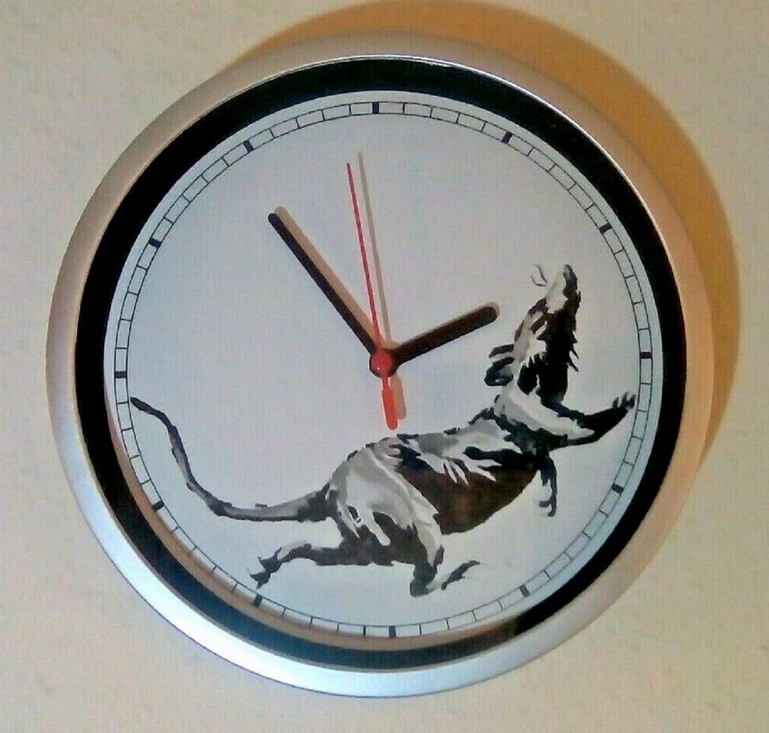 Banksy Real Spray Painted Running Rat Clock Gross: This is an extraordinary piece for any Banksy fan. Recently, the artist known as Banksy has opened a store in London called 'Gross Domestic Product'. Here he exhibits many of his stunning, thought pro