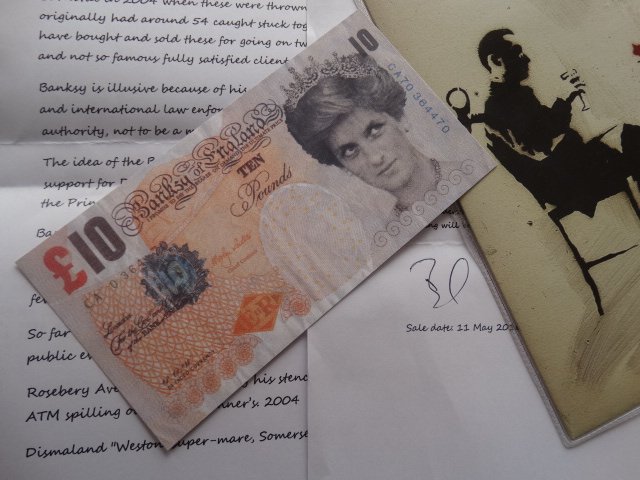 BANKSY: Banksy Di-Faced tenner note (2004)+ Record 7" designed by Banksy. About the note the front reads "Banksy of England". DI FACED CURRENCY. "Please note that these notes do not have any of the security f