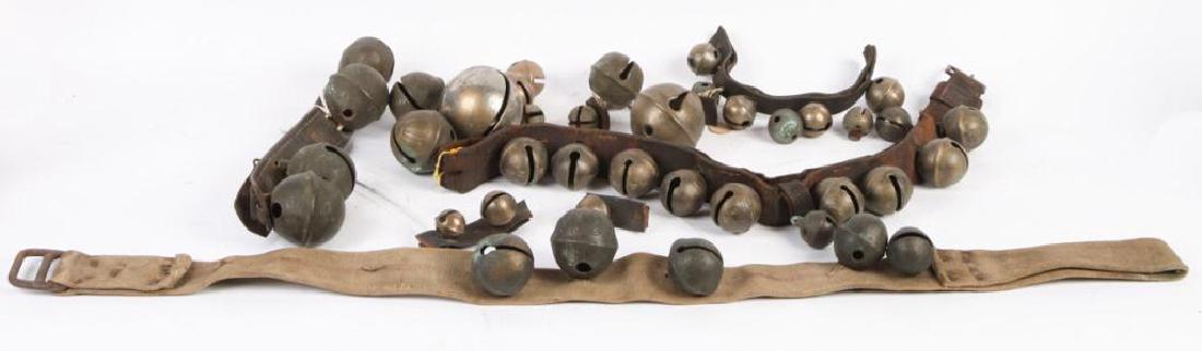 INTERESTING LOT OF SIGNED BELLS: Including: Neck strape signed N.M. consisting of (9) 2 inch bells, strap of (4) with one signed N.S., single 3 inch bell signed N.S., rump strap of (4) 2 3/4 inch bells (and under) signed N.S., (5) lo