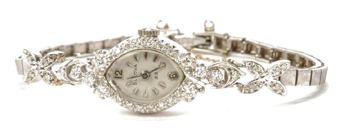 14k WHITE GOLD & DIAMOND BULOVA LADIES WRISTWATCH: Dial 9/16 inches. Serial number 402586. 15.4 grams (overall)